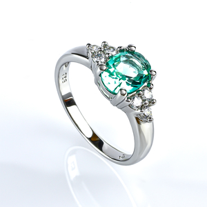 Elegant Silver Ring With Oval Cut Paraiba Gemstones and Simulated Diamonds
