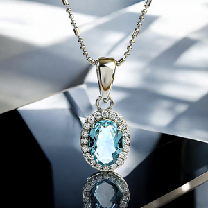 Oval-Cut Silver Solitaire Halo Pendant with Aquamarine