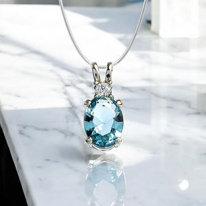 Oval-Cut Silver Solitaire Pendant with Aquamarine