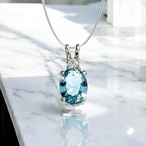 Oval-Cut Silver Solitaire Pendant with Aquamarine
