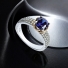 Brilliant Cut 7 mm Tanzanite Silver Ring with Yellow Gold
